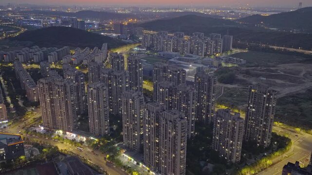Aerial photography of urban residential areas with numerous high-rise buildings at sunset.
