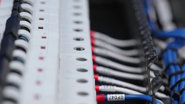 Marking electrical wiring wires with thermally printed nylon tape. 