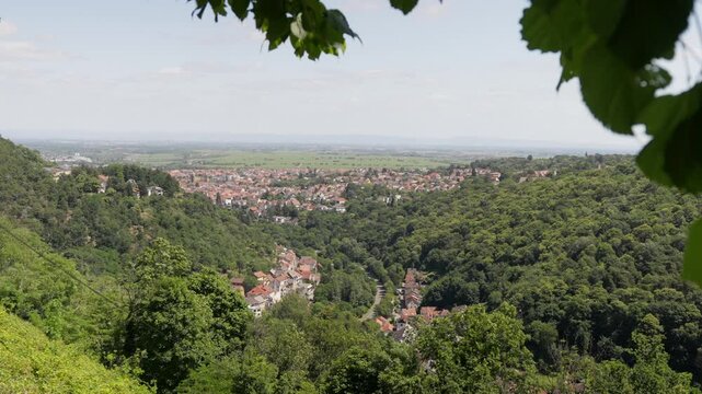 Panoramic View of the Picturesque Town Bad D&uuml;rkheim Nestled in a Lush Green Valley on a Sunny Day