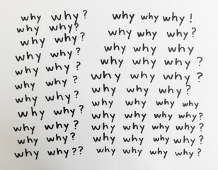 Fototapeta premium A close-up shot of handwritten notes on a piece of paper, asking 'why' questions