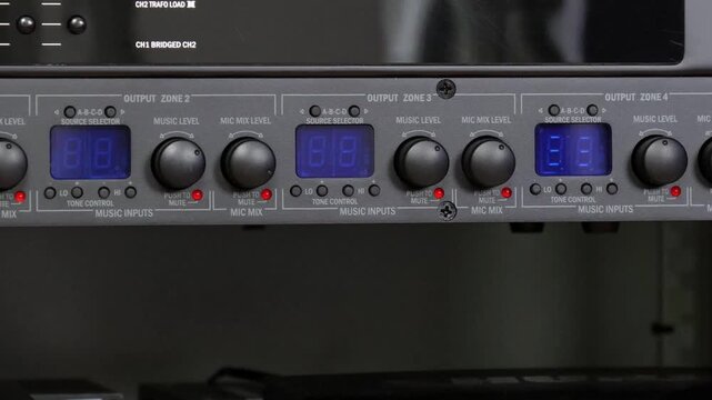 Front control panel of the audio amplifier with level controls and display. 