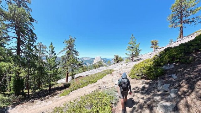 Following Man Hiking Down Switchback in Yosemite National Park
