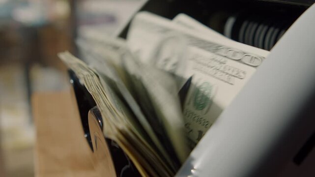 A surprising moment unfolds as a vintage toaster reveals stacks of cash hidden within its compartments in a charming kitchen
