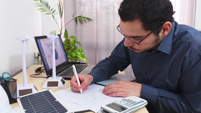 Engineer Using a Scientific Calculator for Complex Project Calculations.