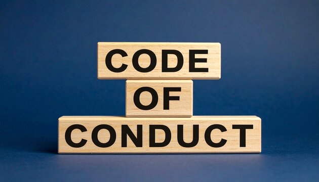 Stacked wooden blocks with black text reading &ldquo;CODE OF CONDUCT&rdquo; against dark blue background