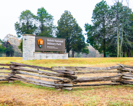 Shiloh National Military Park, Tennessee - USA: Entrance sign to the military park on a rise above split rail fence