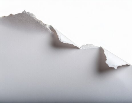 close up of ragged edges of a torn white paper isolated on white background ripped edge
