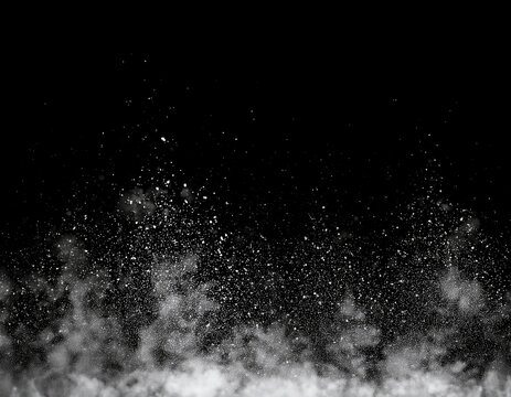 a bottom border of random white dust floating upwards isolated on a black background