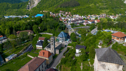 Fototapeta premium High Angle Aerial Panoramic View of Jajce Old Town with St Lukes Bell Tower and Medvjed Kula Bear Tower in Bosnia and Herzegovina