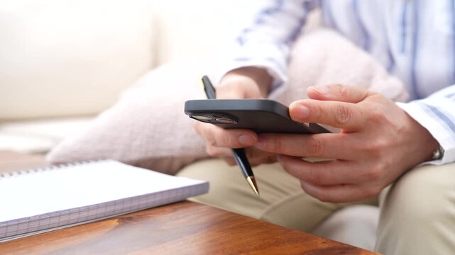 Professional using smartphone to disable notifications and manage digital communication after completing tasks. Mobile productivity, work life balance, focus mode and information management concept