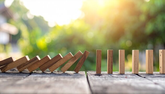 Domino effect wooden blocks falling chain reaction outdoors