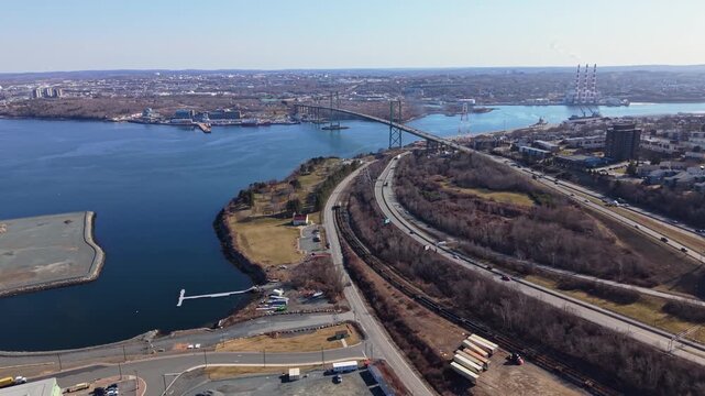 Aerial view A Murray MacKay Bridge Aerial Halifax Nova Scotia Canada Connecting Dartmouth Carrying City Traffic Urban Skyline High Rise Buildings Transport Infrastructure 4K