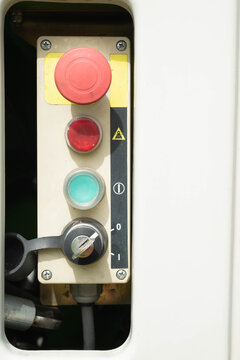 Close-up view of operation buttons on industrial control station on a hydraulic lift