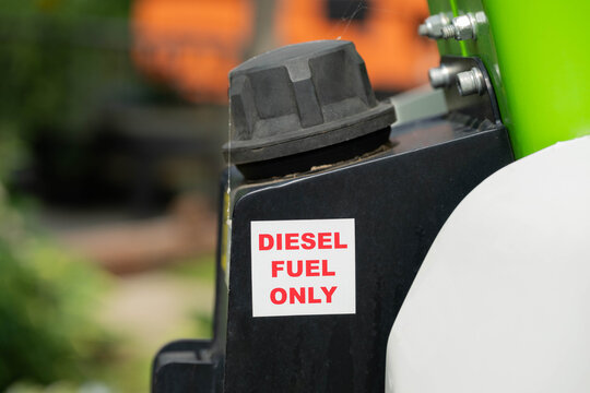 Diesel fuel only, red letter text on a white background, sticker on a piece of machinery.