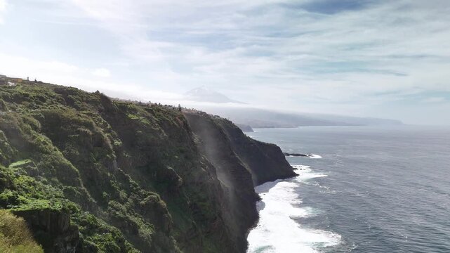 Aerial drone view of steep cliffs and crashing waves, El Sauzal, Tenerife