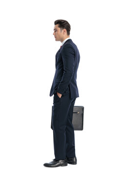 Side view of elegant man holding briefcase