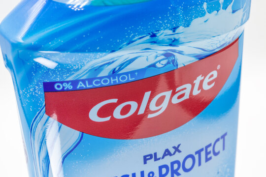 Colgate Plax mouthwash bottle label logo closeup macro on white.