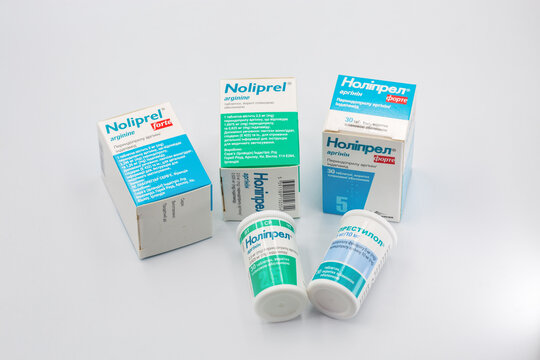 Noliprel and Prestilol boxes and pill bottles closeup on white.