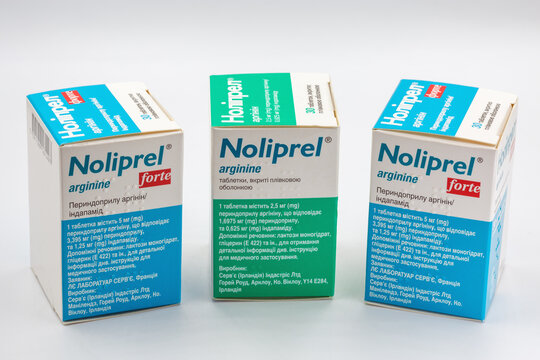 Noliprel and Noliprel Forte tablets boxes group closeup on white.