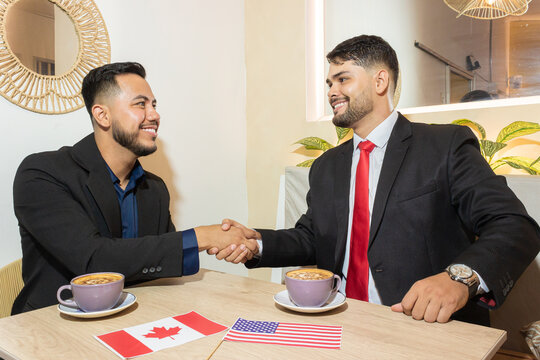 Portrait of young Colombian men smiling because they closed a large business deal with a multinational corporation inside an office in Neiva, Huila, Colombia. Concept of business and executive