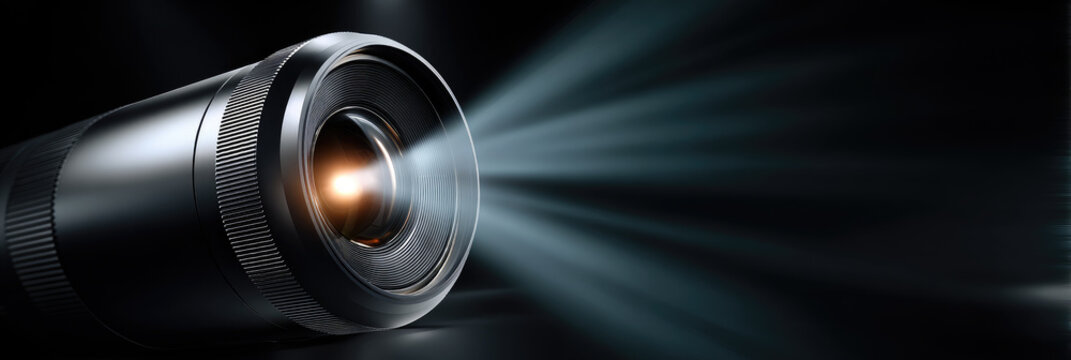Portable mini projector casting a bright light beam, creating an immersive home cinema experience, illustrating modern entertainment technology and video projection