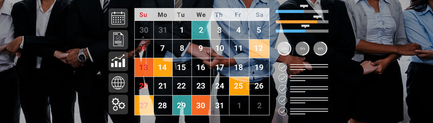 A business team stands together with a calendar and statistical graphics, symbolizing effective planning and teamwork for successful project management in a corporate setting. Gantry © InfiniteFlow