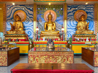 Fototapeta premium Golden Buddha statues on temple altar, Chiang Mai, Thailand