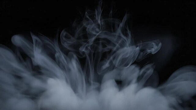 Abstract slow-motion cloud explosion revealing wispy vapor formations against a black background