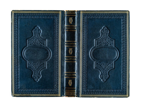 Antique hardcover book with an ornate decorative binding made of cloth and illustrated cardboard, featuring rich gold embossing and vivid colors. Isolated on a white background 