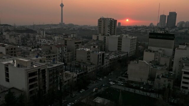 an aerial view of Tehran the capital of Iran during the sunset