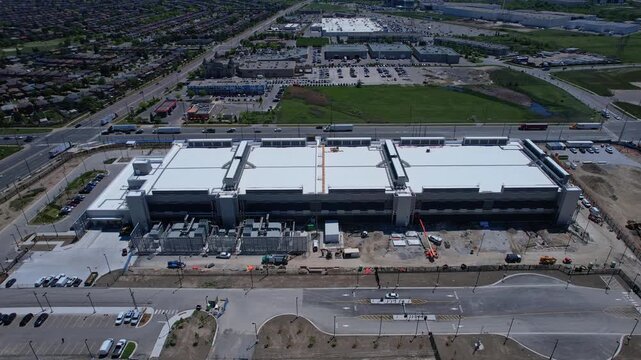 Data center construction aerial view. Data center for internet and AI, quick expansion worldwide. They power cloud services, streaming, banking, e-commerce