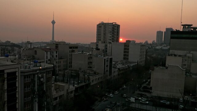 an aerial view of Tehran the capital of Iran during the sunset