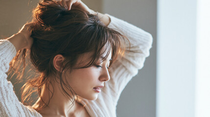 Fototapeta premium Thoughtful young woman with closed eyes posing by bright window indoors