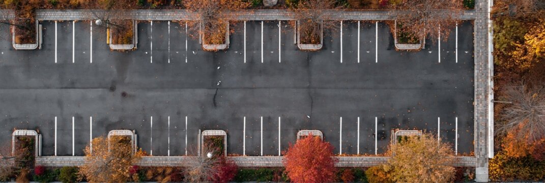 grocery store parking lot with parking spaces for cars on asphalt