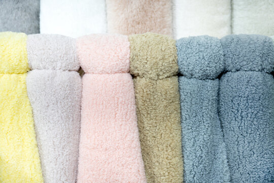 Fur fabric on a rack. Beautiful fur for sewing fur coats at the factory.