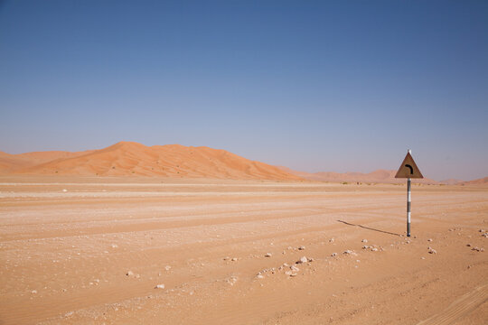Road sign on desert track in the Rub al Khali, Empty Quarter, Oman