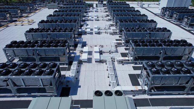 Aerial view of Hyperscale Datacenter, AI data center cooling systems, piping electrical equipment. Chilling equipment and electrical substations generators