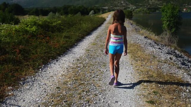 Little beautiful girl about Ricice lake, Croatia