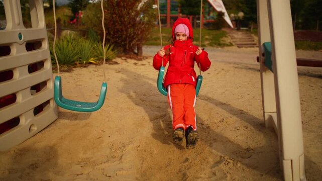 Beautiful little girl on swing