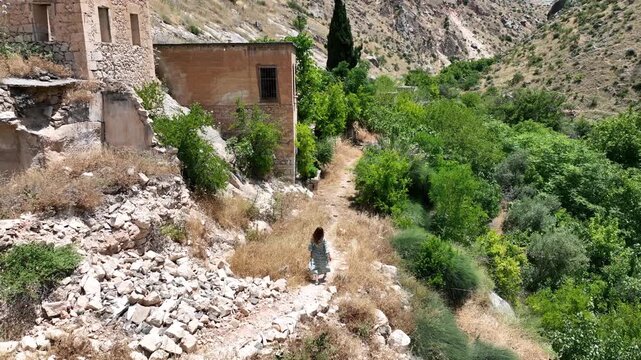 Female tourist visiting Halfeti Savasan Village, May, 11, 2023, Sanliurfa, Halfeti, Turkey