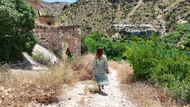 Female tourist visiting Halfeti Savasan Village, May, 11, 2023, Sanliurfa, Halfeti, Turkey