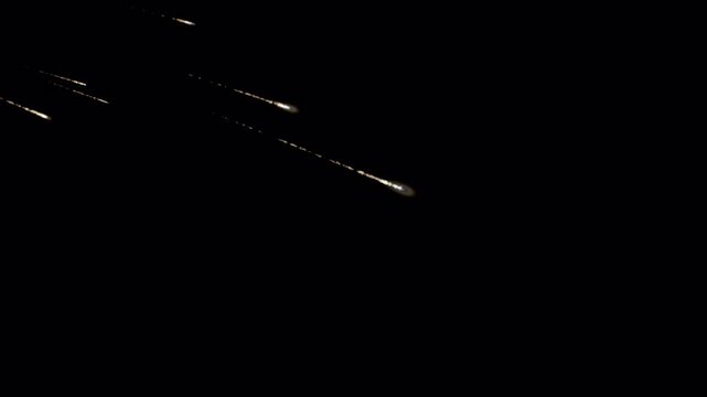 Fiery Meteor Shower Streaks on Black Background with Burning Space Debris Trails, Cinematic Asteroid VFX Animation Loop