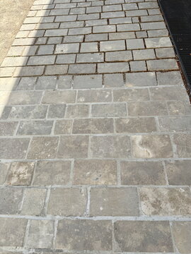 High angle view of stone paved walkway tiles texture in Germany