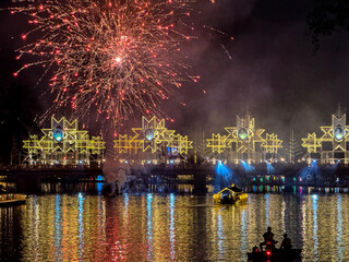 Fireworks exploding over Nawarat Bridge at festival in Chiang Mai