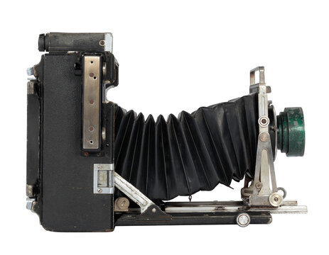 Vintage bellows camera isolate on transparent background (png image). Antique folding bellows camera profile view with weathered patina. High-quality analog photography equipment template.