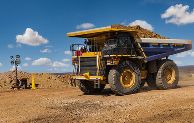 Mining haul truck transporting soil load in open pit mine industrial quarry © poco_bw