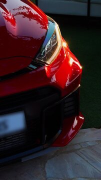 Red Sports Car Front Headlight DRL Active Close Up Cinematic Outdoor Detail Shot Natural Light