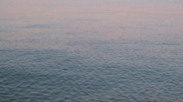 Defocused Pastel Water Surface at Dusk with Gentle Ripples