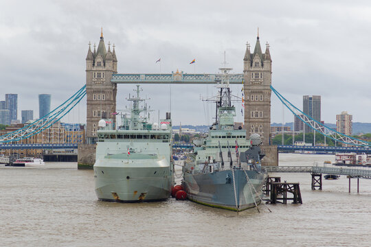Royal Canadian Navy vessel HMCS William Hall (left) is moored next to HMS Belfast in front of Tower Bridge in London