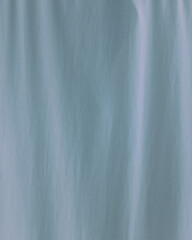 Obraz premium Abstract blue gradient texture background with soft vertical motion blur. Smooth flowing lines create a calm modern backdrop, ideal for minimal design, wallpaper, and digital projects. 